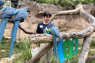 A Unity student pictured with exotic birds